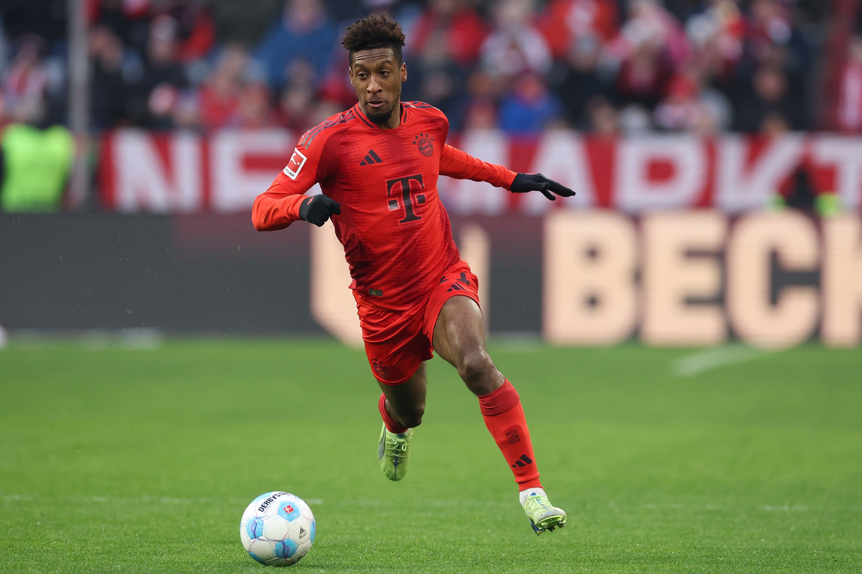 Bayern winger Kingsley Coman dribbles with the ball at the Allianz Arena.