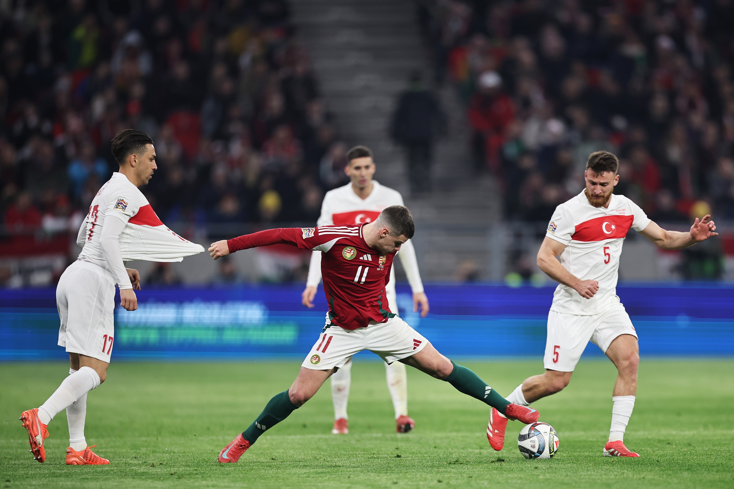 Milos Kerkez stretches to kick a ball for Hungary.