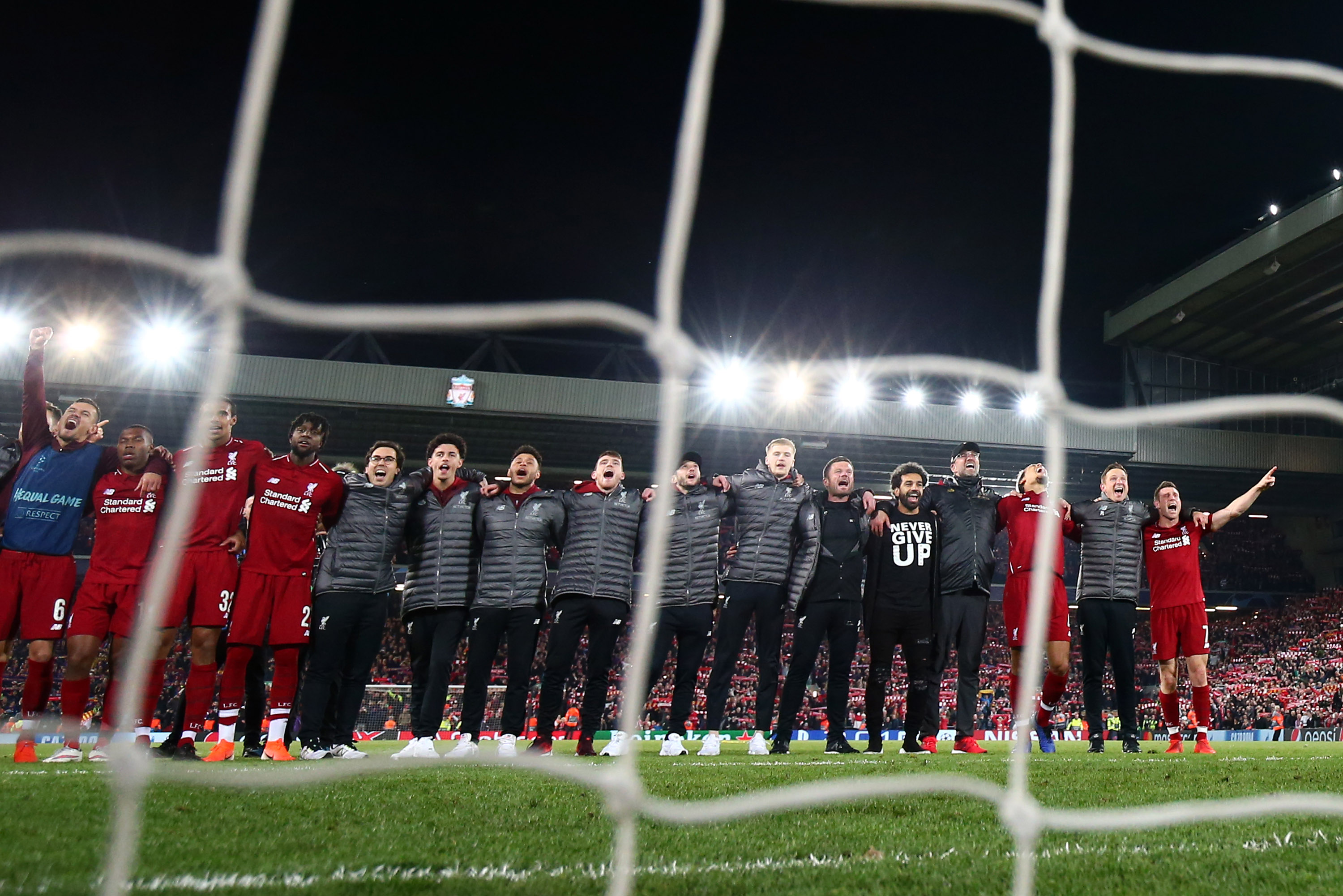 Liverpool players and staff celebrate the epic 4-0 win over Barcelona at Anfield in 2019