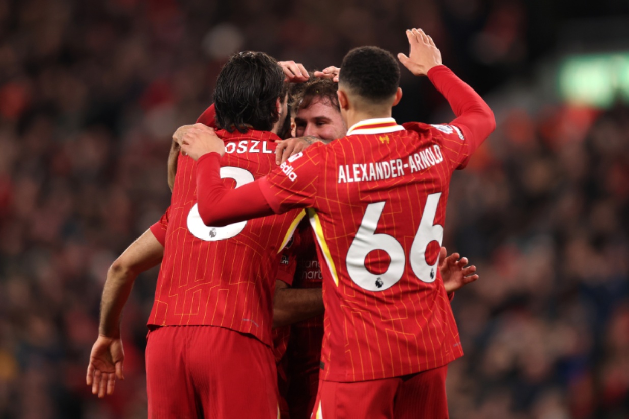 Dominik Szoboszlai celebrates with Alexis Mac Allister and Trent Alexander-Arnold
