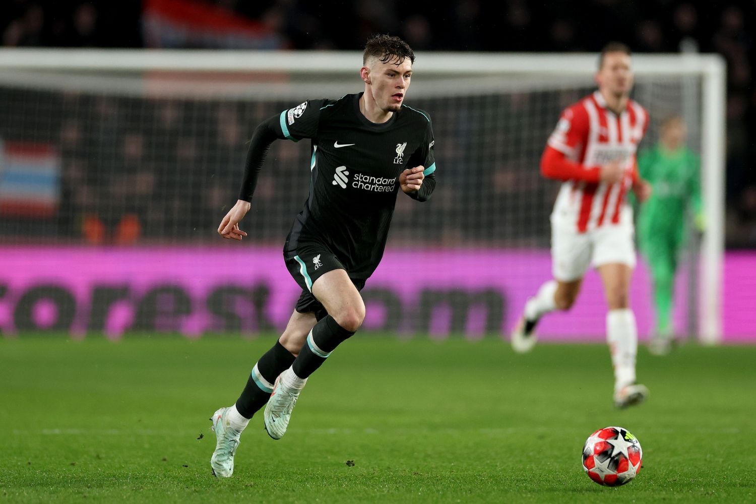 Conor Bradley plays against PSV for Liverpool