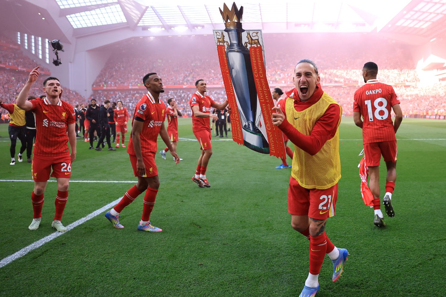 Kostas Tsimikas celebrates with a cardboard league title