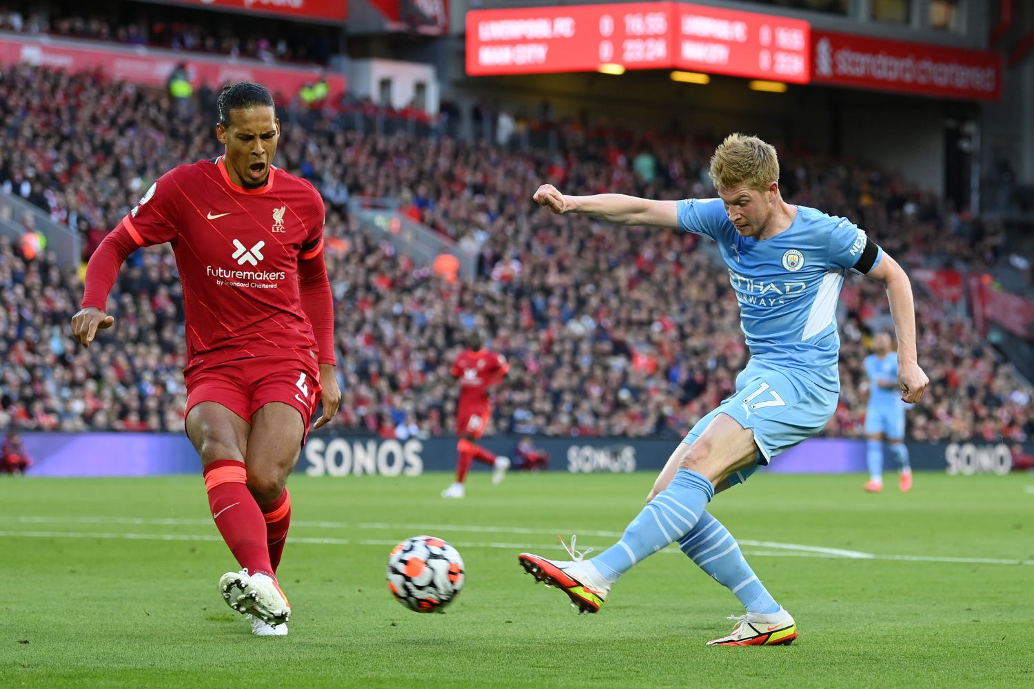 Kevin De Bruyne is approached by Virgil van Dijk at Anfield