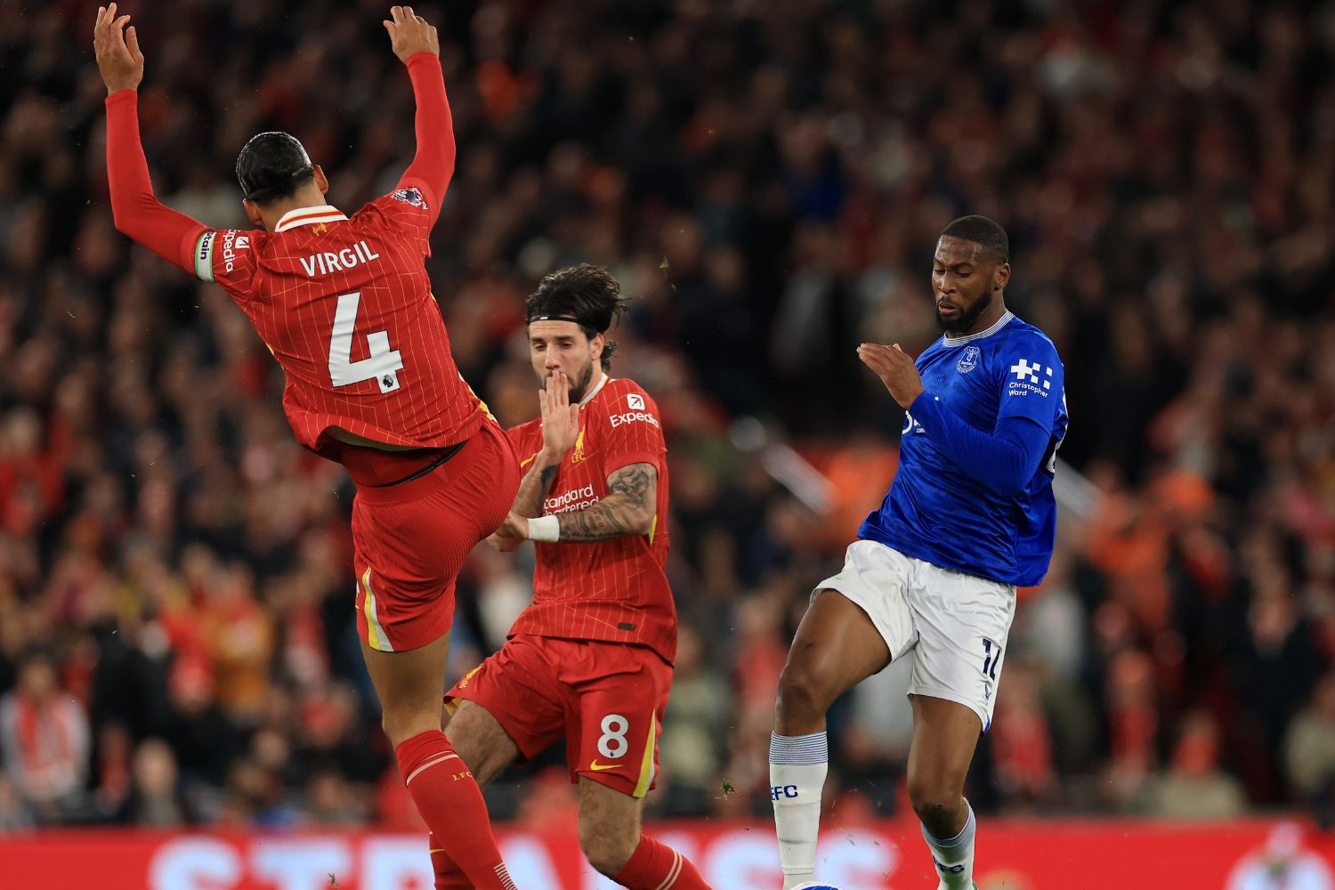Van Dijk battles with Beto at Anfield