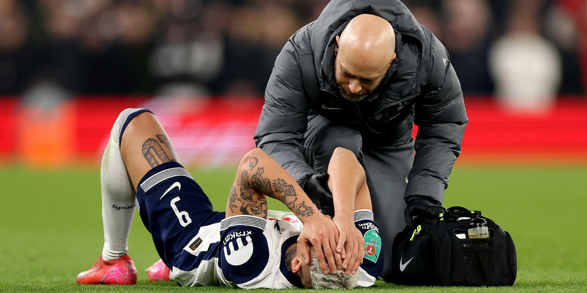 Richarlison lies injured at Anfield