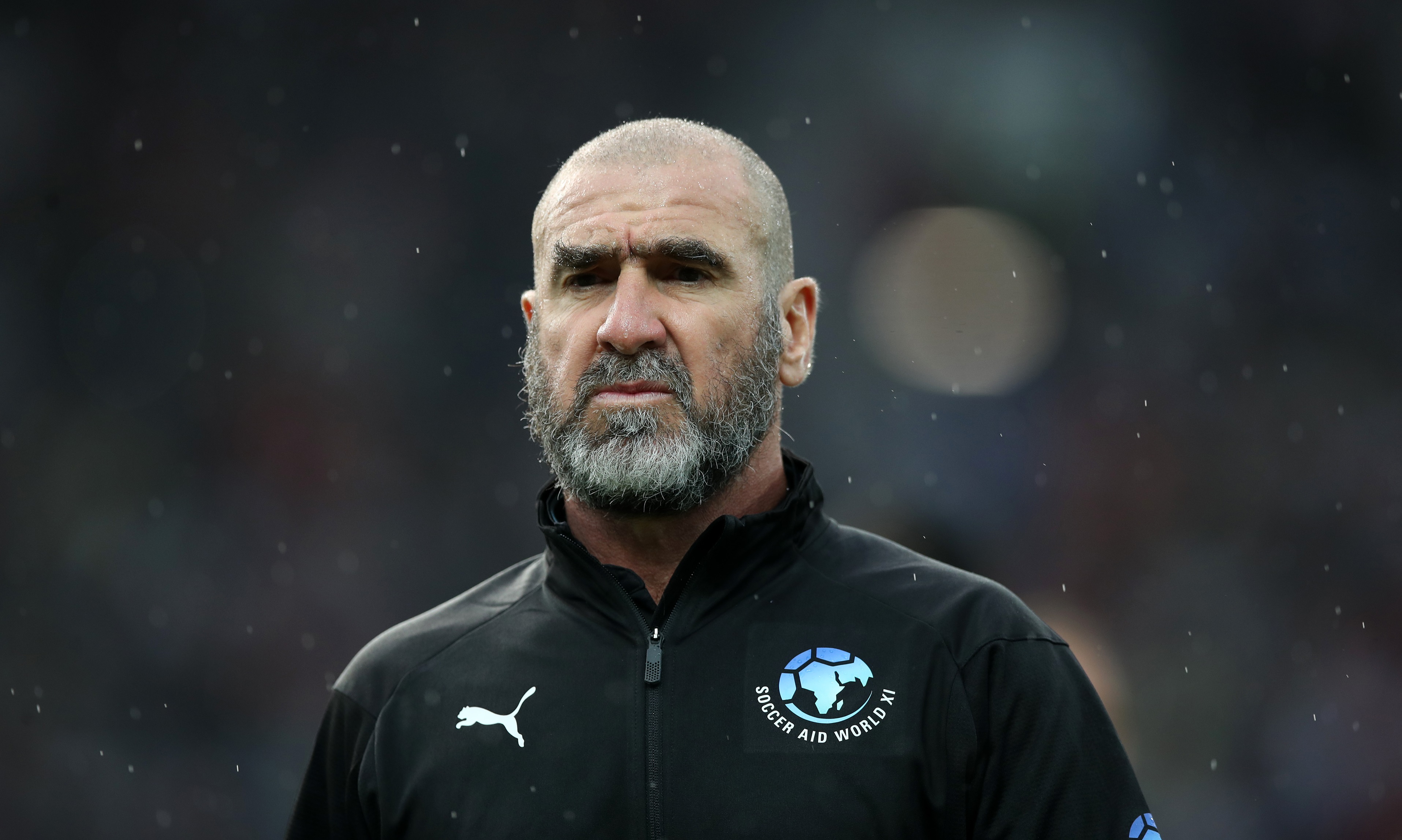 Eric Cantona looks out during Soccer Aid match.