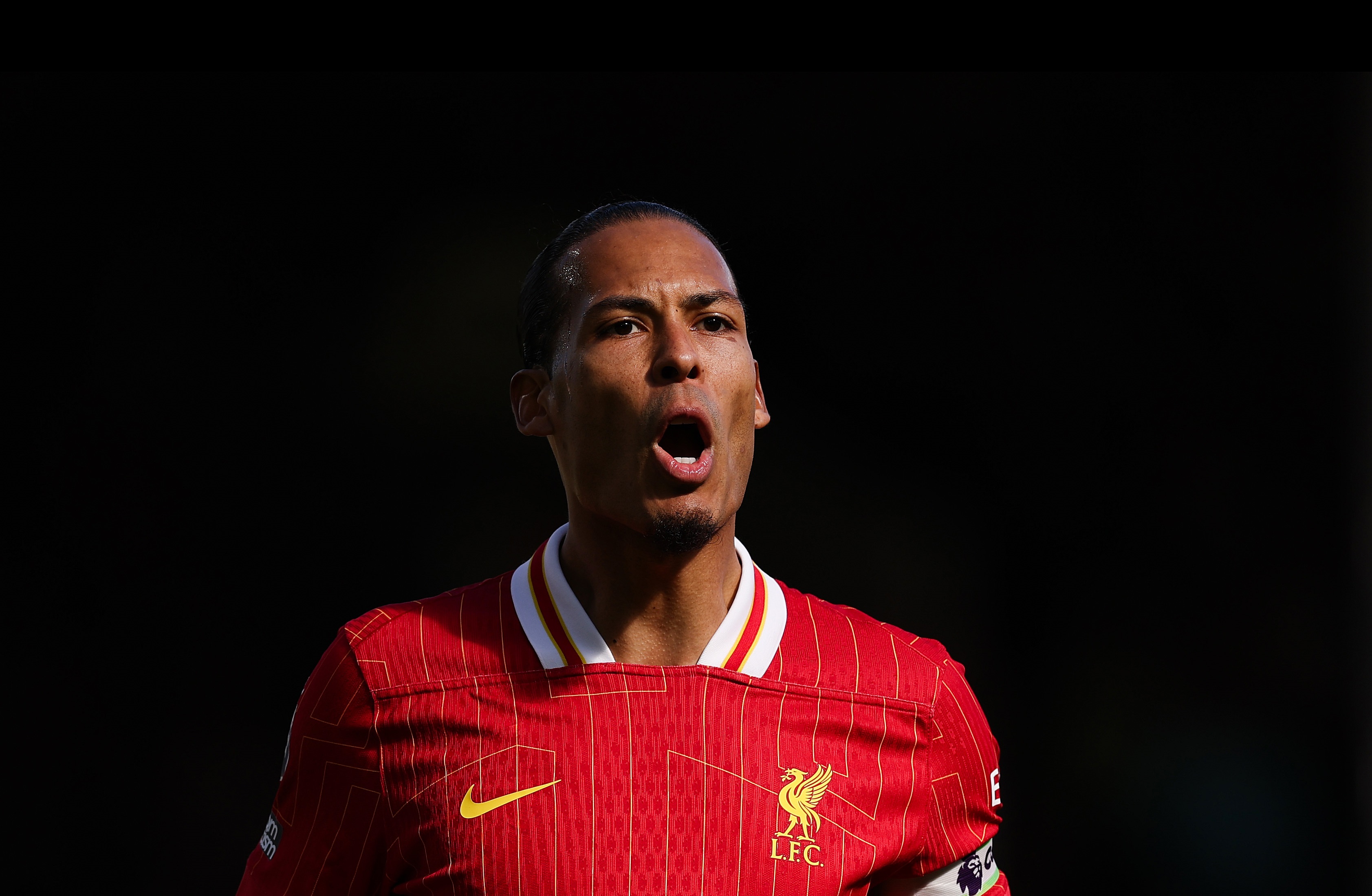 Virgil van Dijk shouts at Liverpool teammates at Craven Cottage.