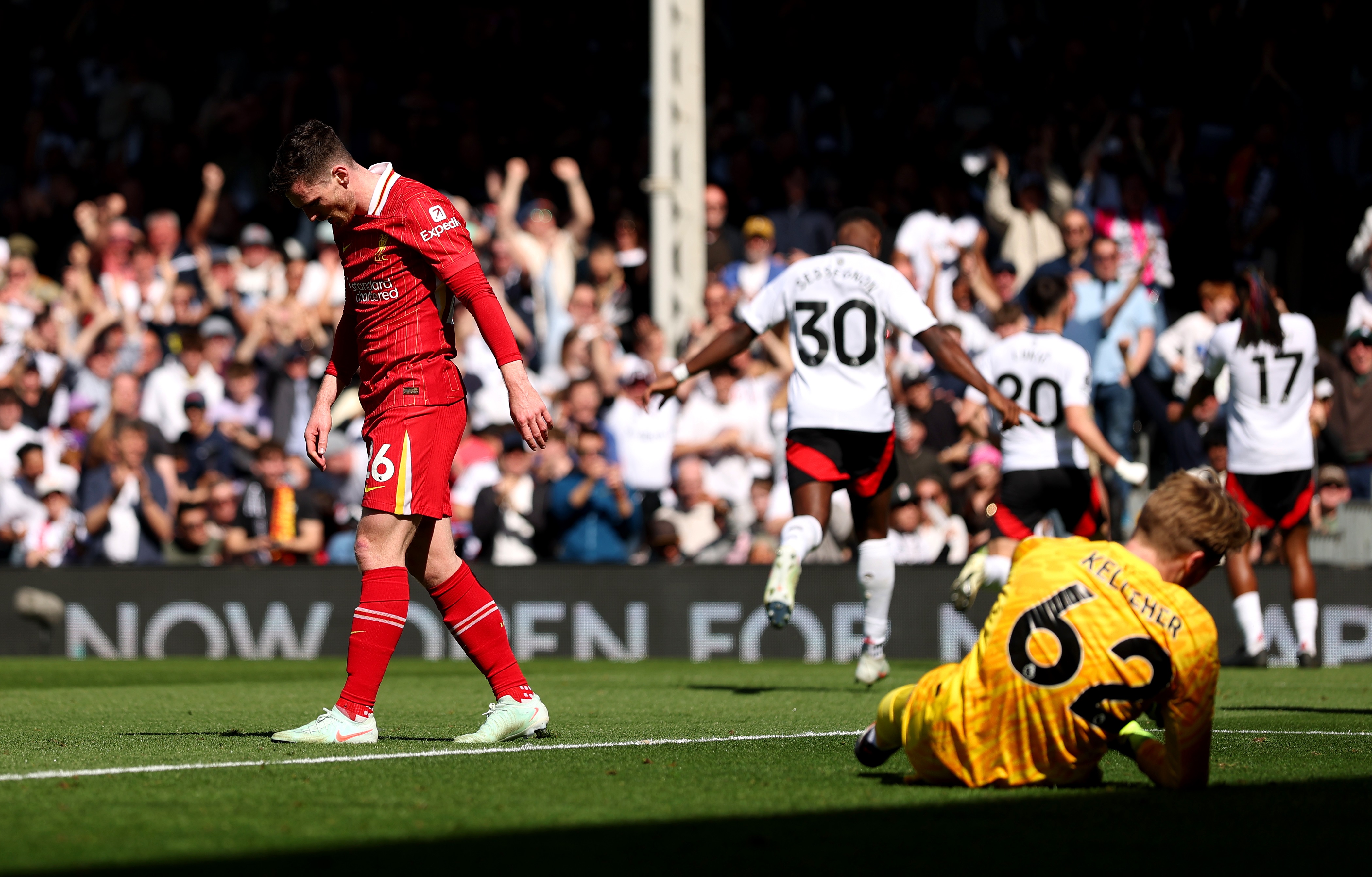 Andy Robertson walks off with his head down after Alex Iwobi goal.