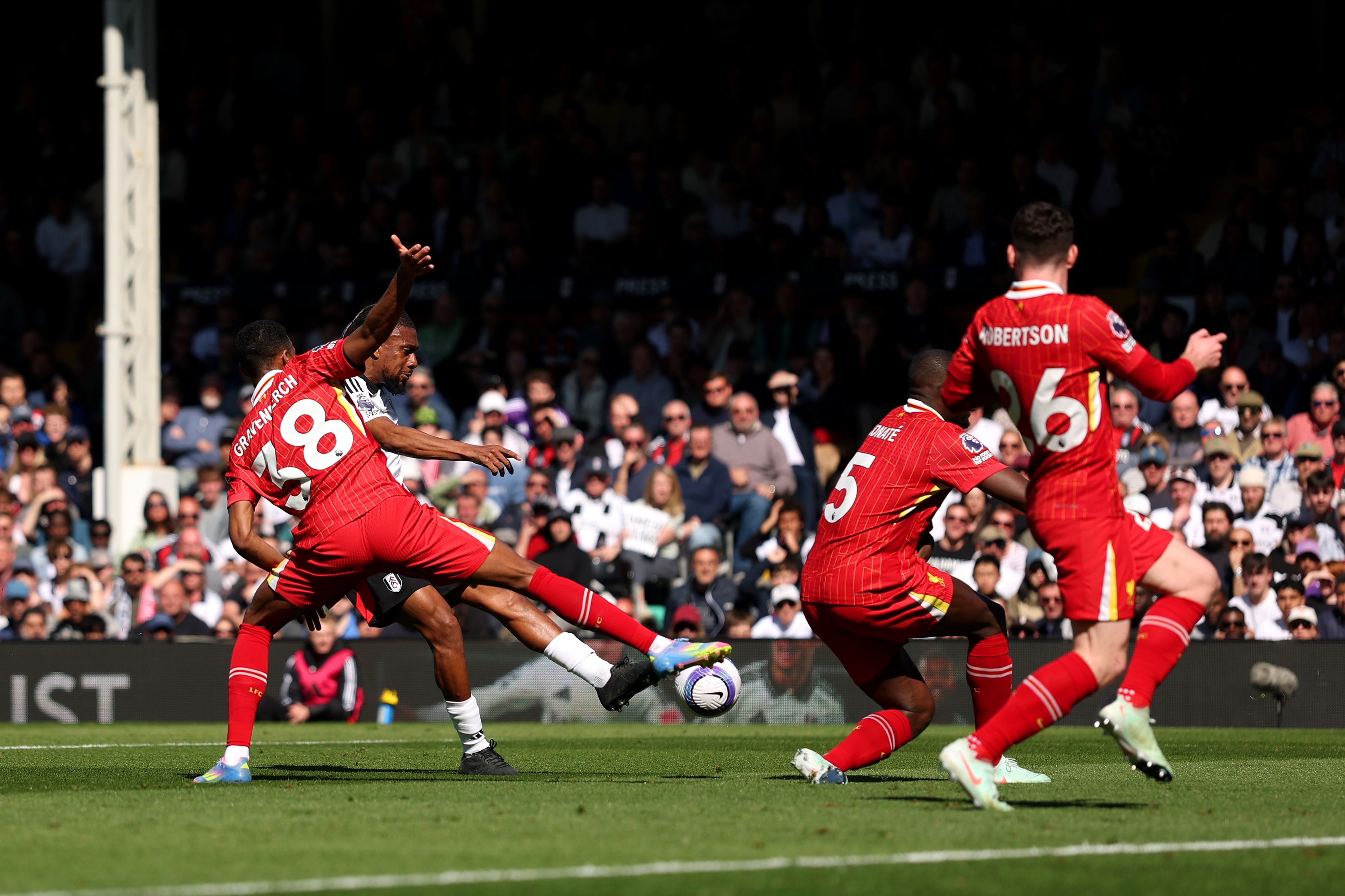 Andy Robertson runs in the defence.