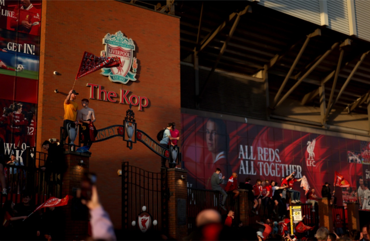Liverpool fans celebrate outside Anfield after the Reds won the Premier League
