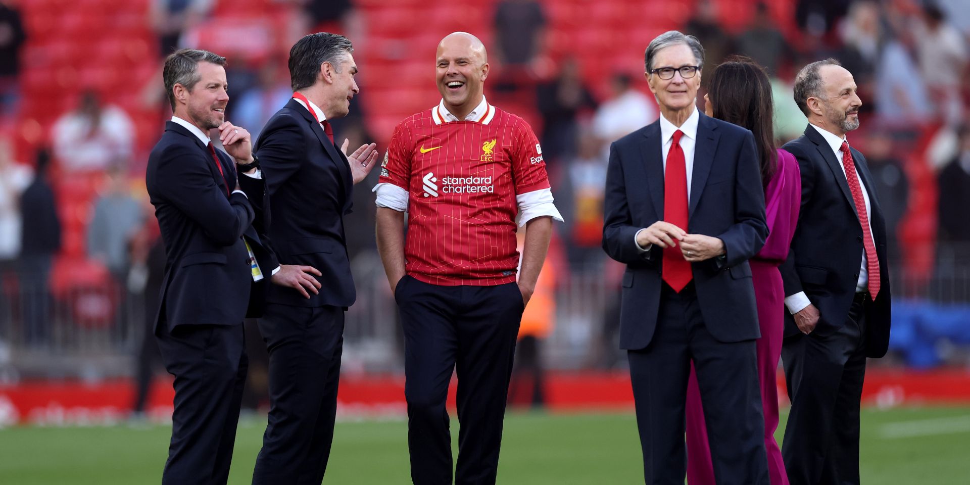 John Henry with Arne Slot and other Liverpool officials