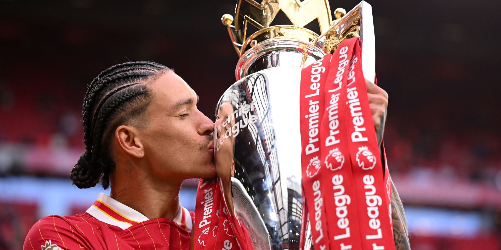 Darwin Nunez celebrates with the Premier League title