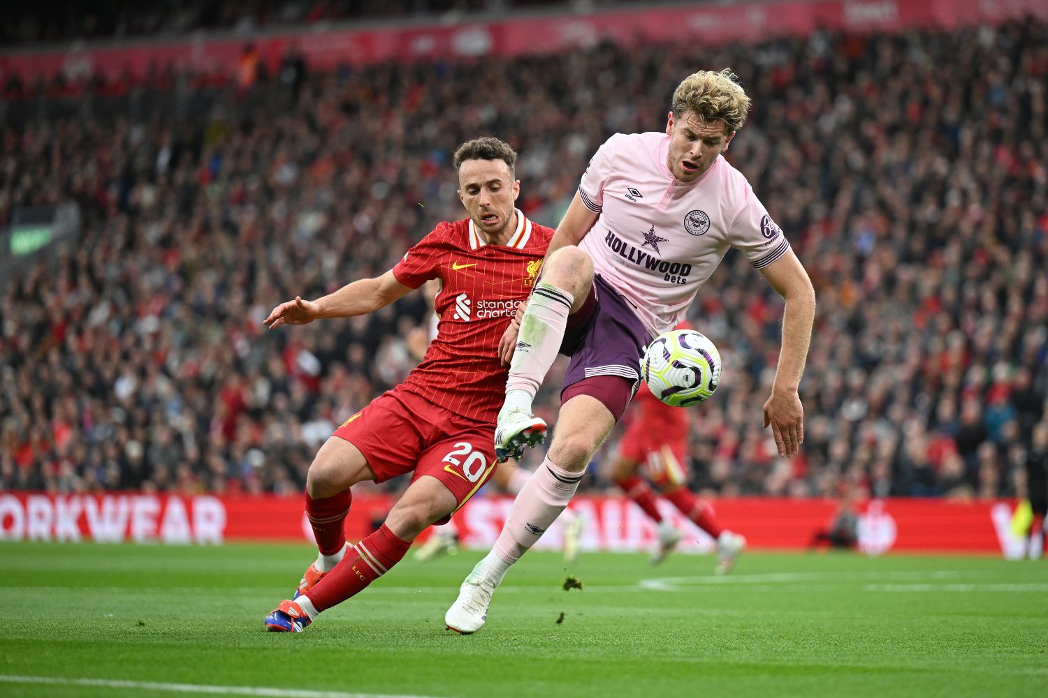 Nathan Collins battles with Diogo Jota for the ball