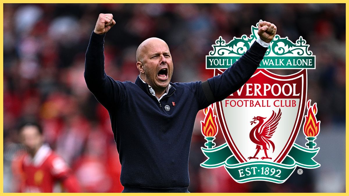 Arne Slot punches the air with both arms next to Liverpool club crest.
