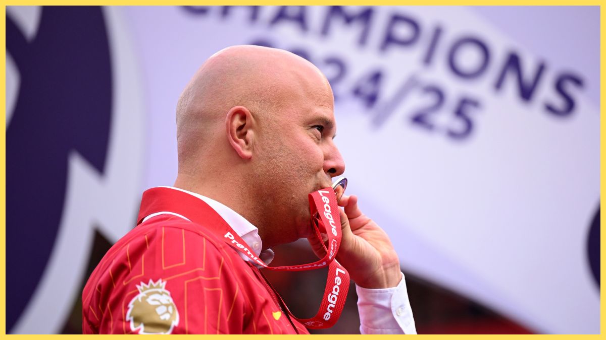 Arne Slot kisses Premier League medal.