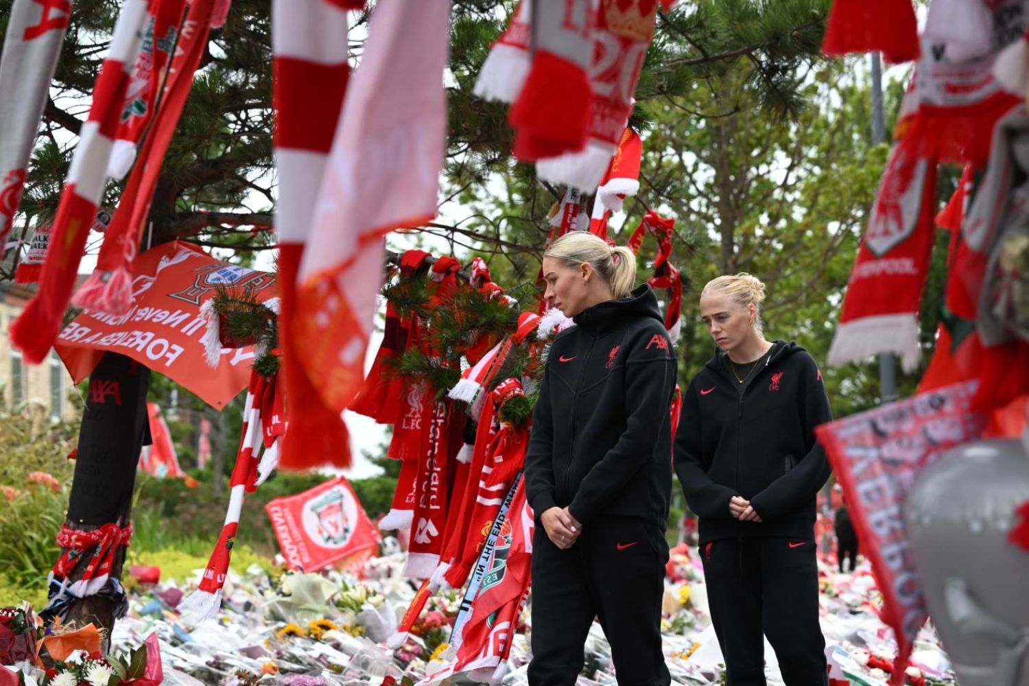 Gemma Bonner and Grace Fisk pay respects to Diogo Jota