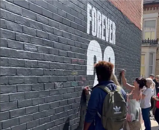 Liverpool fans have been signing condolences for Diogo Jota on a wall near Anfield