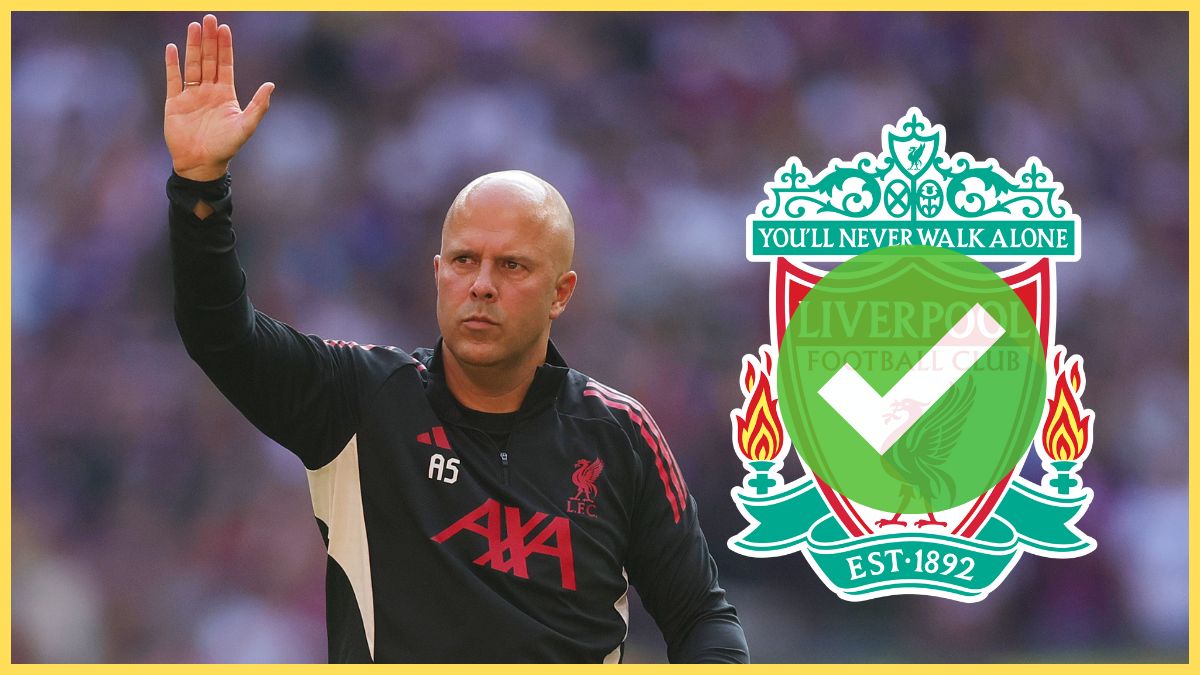 Arne Slot waves his hand next to Liverpool club crest.