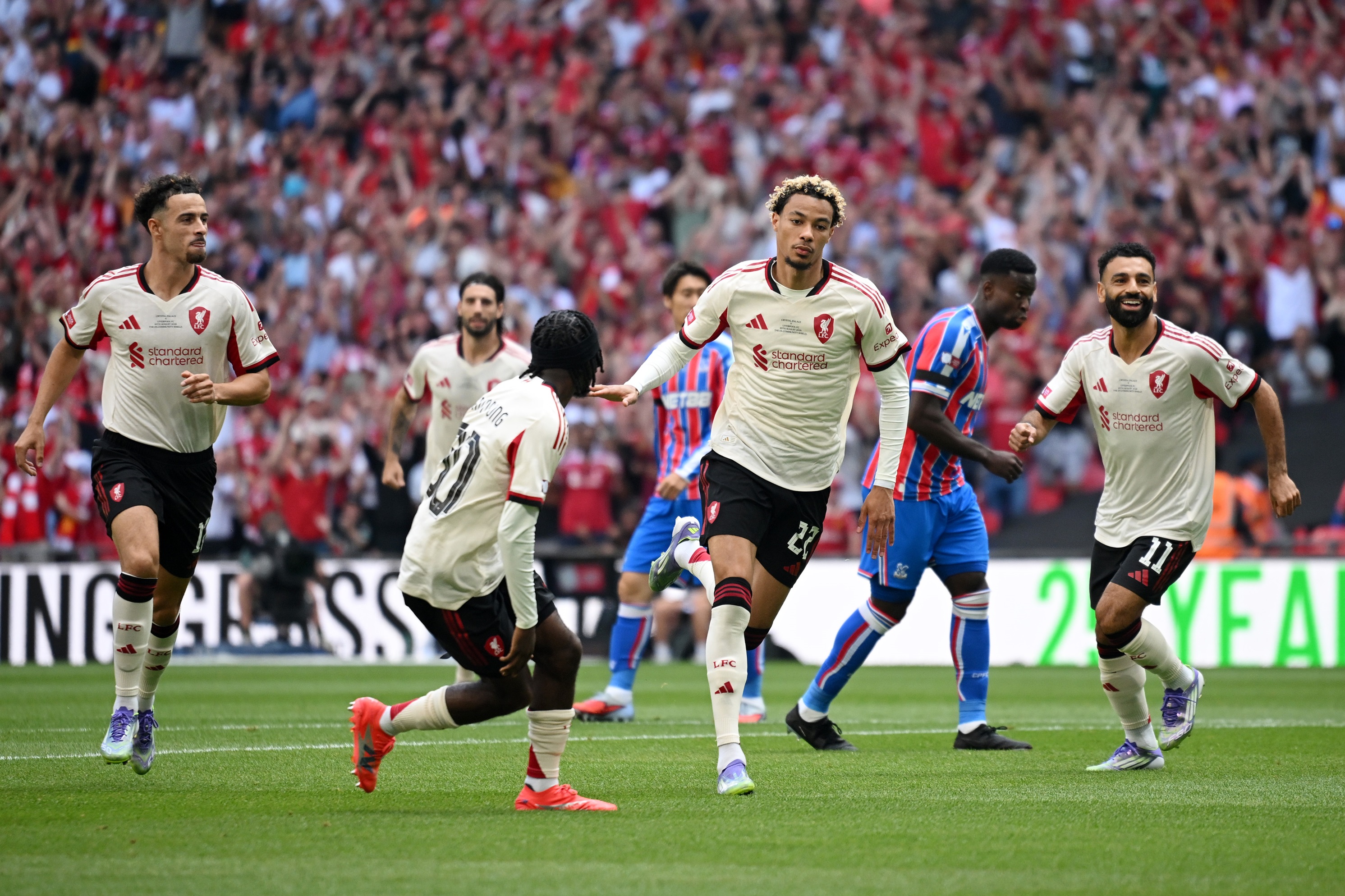 Hugo Ekitike runs away in celebration after scoring against Crystal Palace.