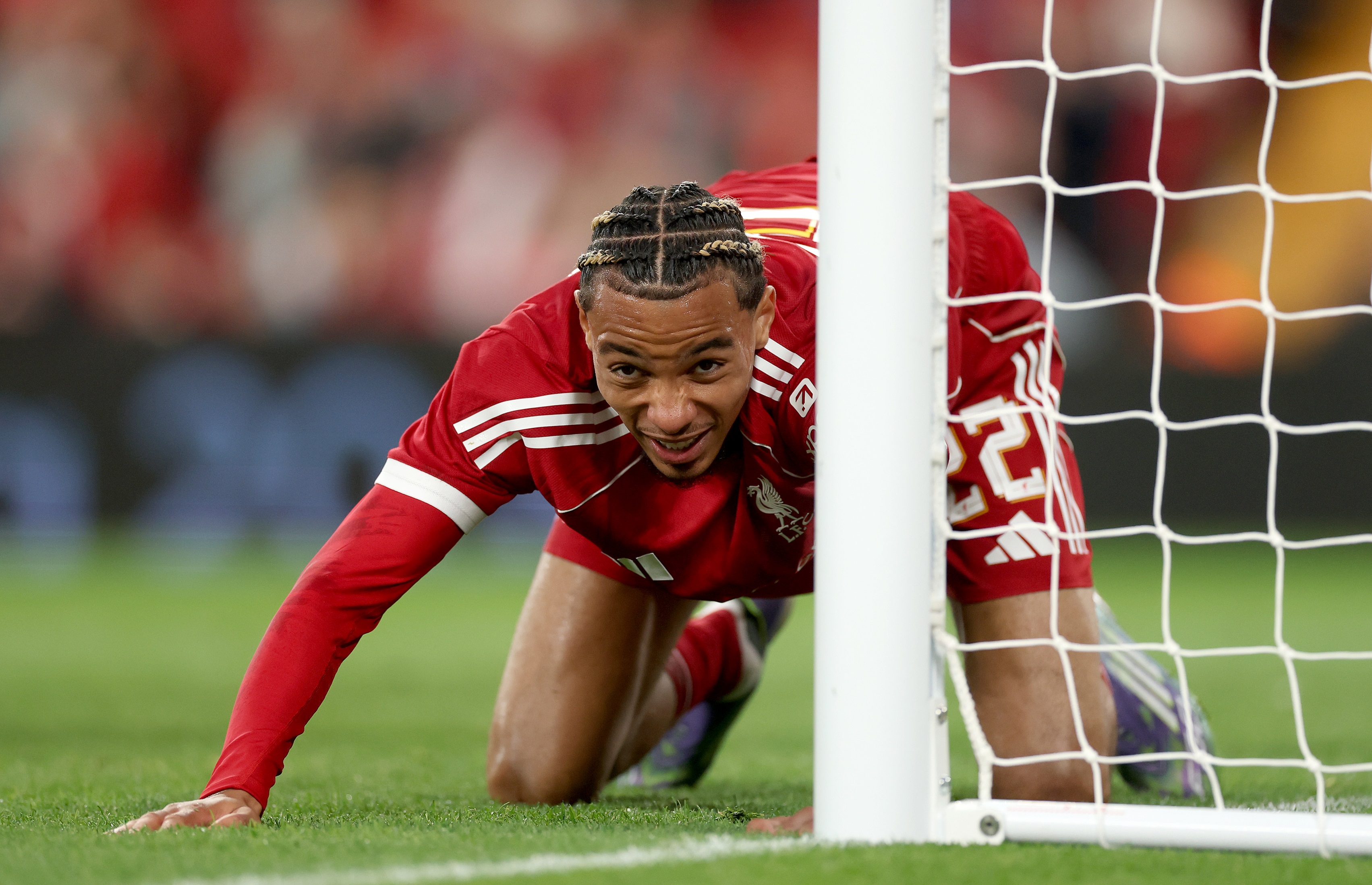 Hugo Ekitike lies down on all fours during Liverpool games.