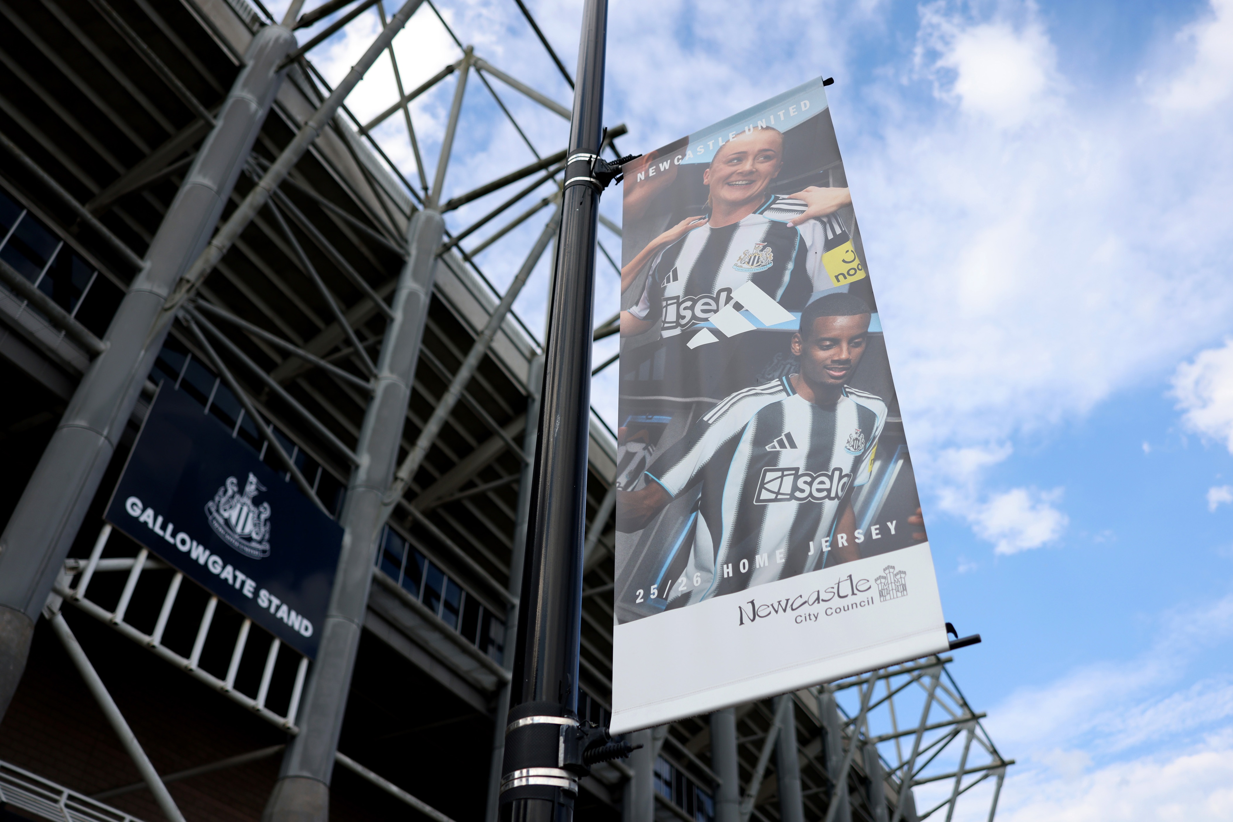 Alexander Isak pictured on a banner outside St James' Park stadium.