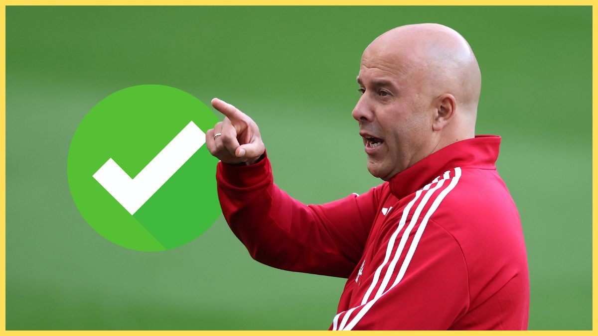 Liverpool head coach Arne Slot points next to a green checkmark.