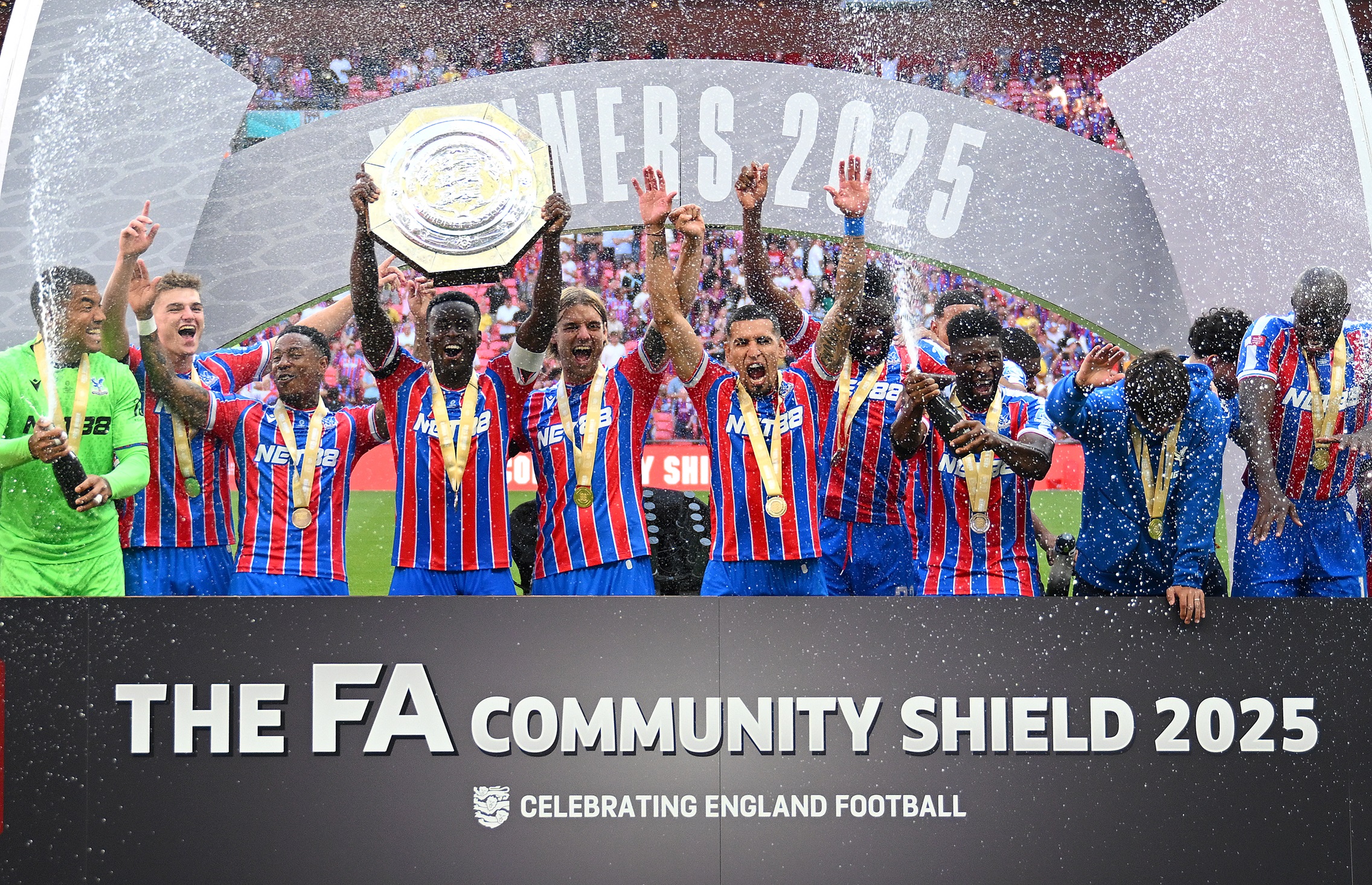 Marc Guehi lifts Community Shield trophy with Crystal Palace teammates.