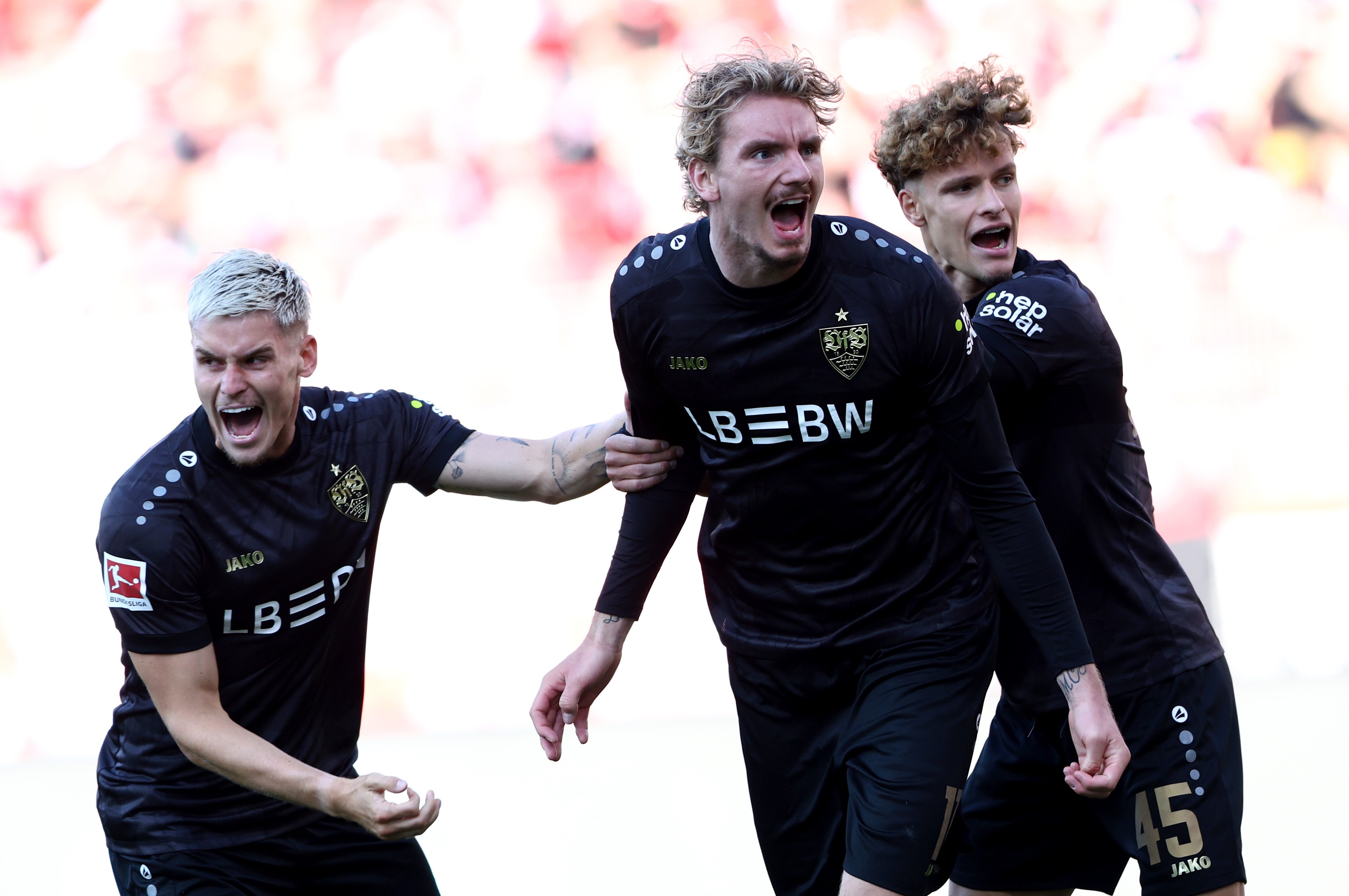 Nick Woltemade celebrates with Stuttgart teammates.