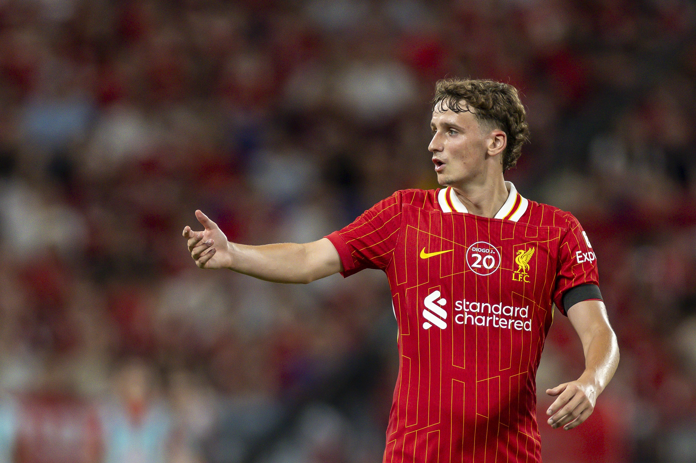 Tyler Morton gestures with his right arm during Liverpool game.