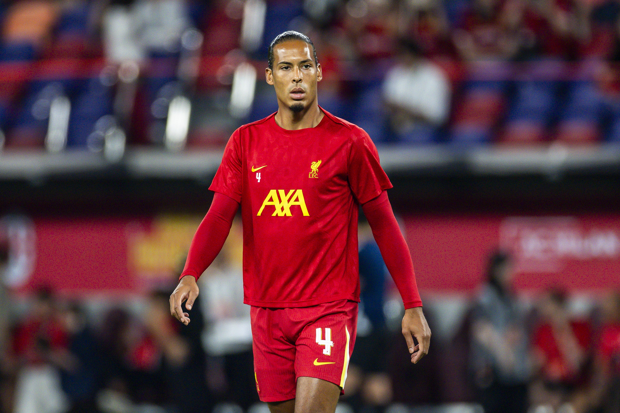 Virgil van Dijk walks on the pitch ahead of Liverpool game.