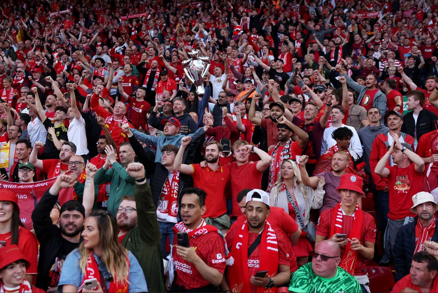 Liverpool fans celebrate a goal at Anfield