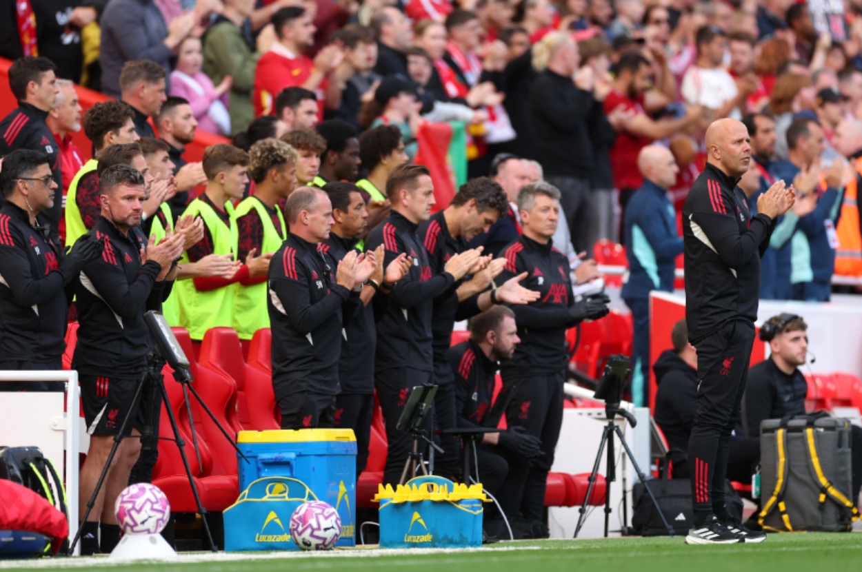 Arne Slot and his coaching staff join in a minute's applause in memory of Diogo Jota at Anfield