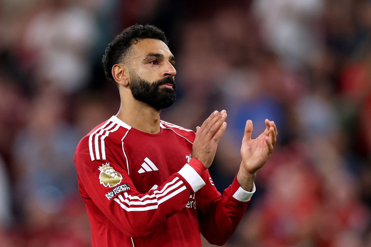Mo Salah of Liverpool looks emotional as he applauds the fans