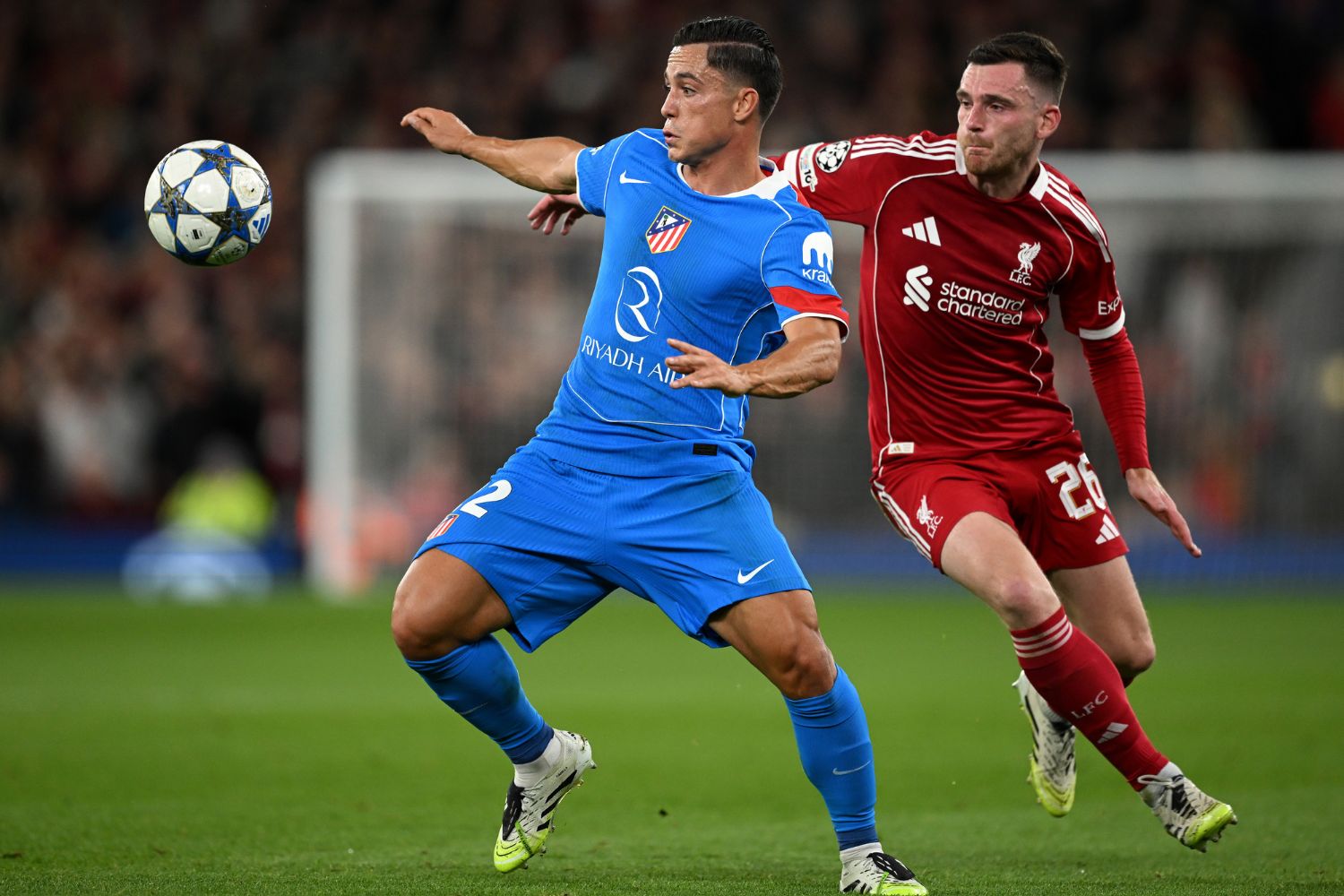 Andy Robertson competes with Giacomo Raspadori of Atletico de Madrid