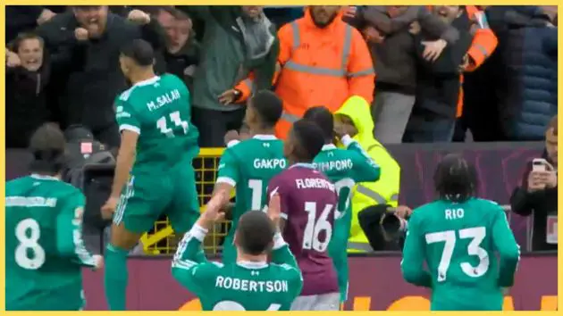 Andy Robertson celebrates Mo Salah's goal