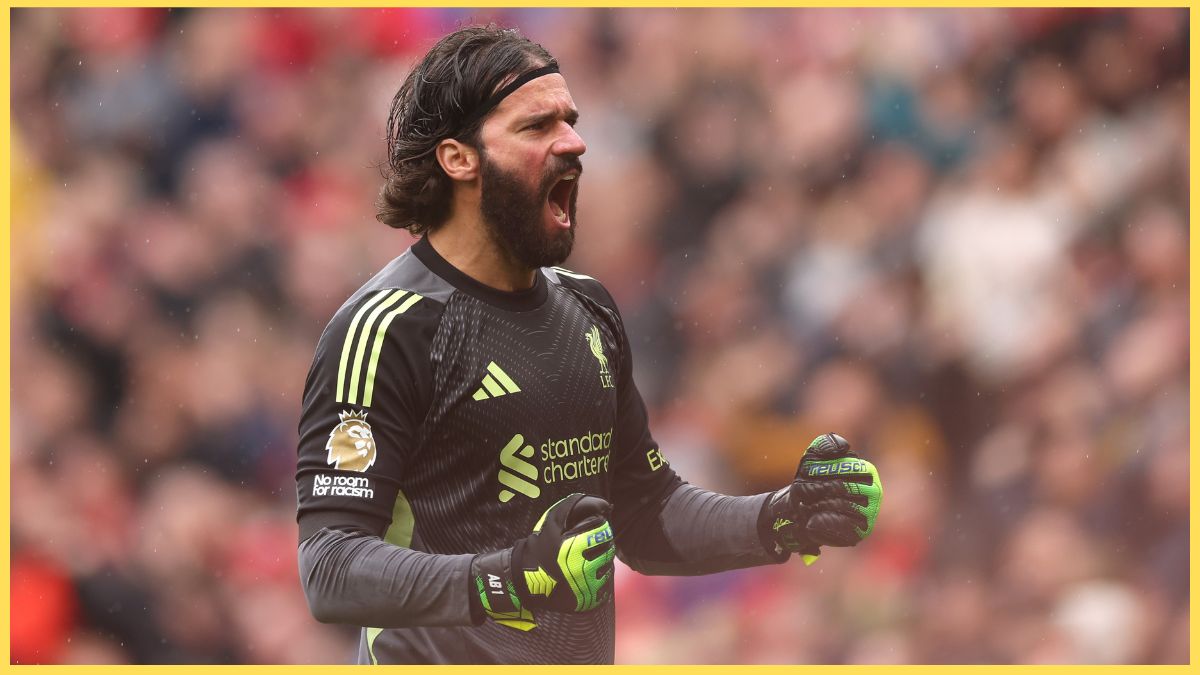 Alisson Becker celebrates against Everton