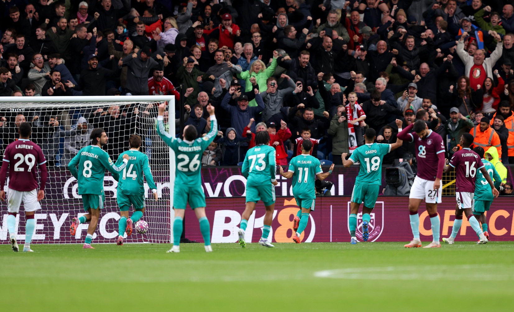 Liverpool celebrate their last-gasp victory over Burnley