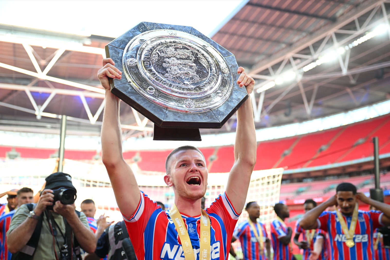 Adam Wharton lifts the Community Shield after Crystal Palace's penalty shootout victory over Liverpool