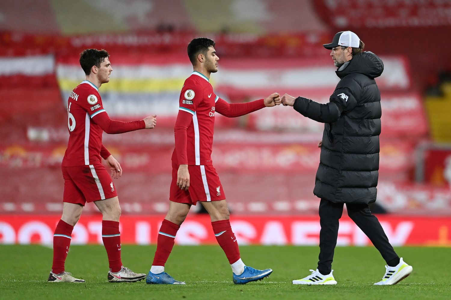 Jurgen Klopp with Ozan Kabak and Andy Robertson of Liverpool following the Premier League match vs Chelsea at Anfield on March 04, 2021