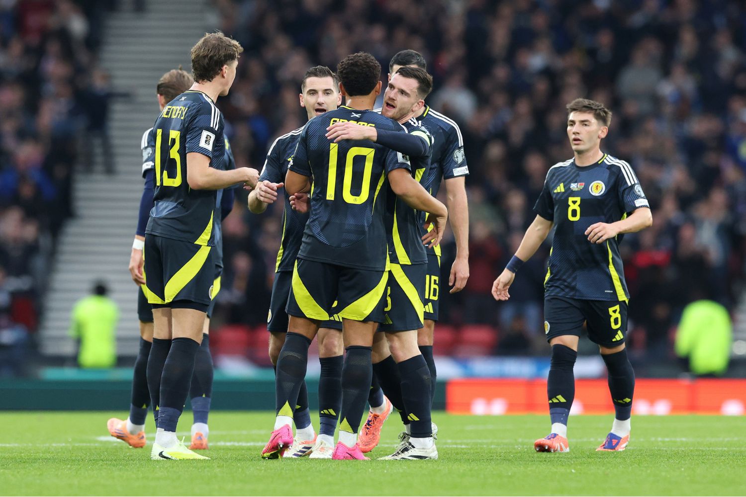 Andy Robertson celebrates with Che Adams for Scotland