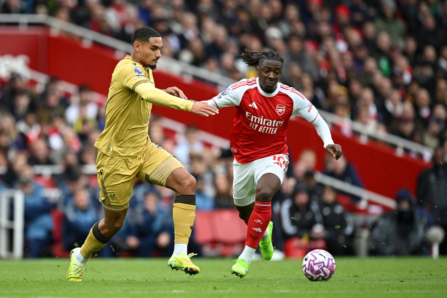 Eberechi Eze of Arsenal is challenged by Maxence Lacroix of Crystal Palace