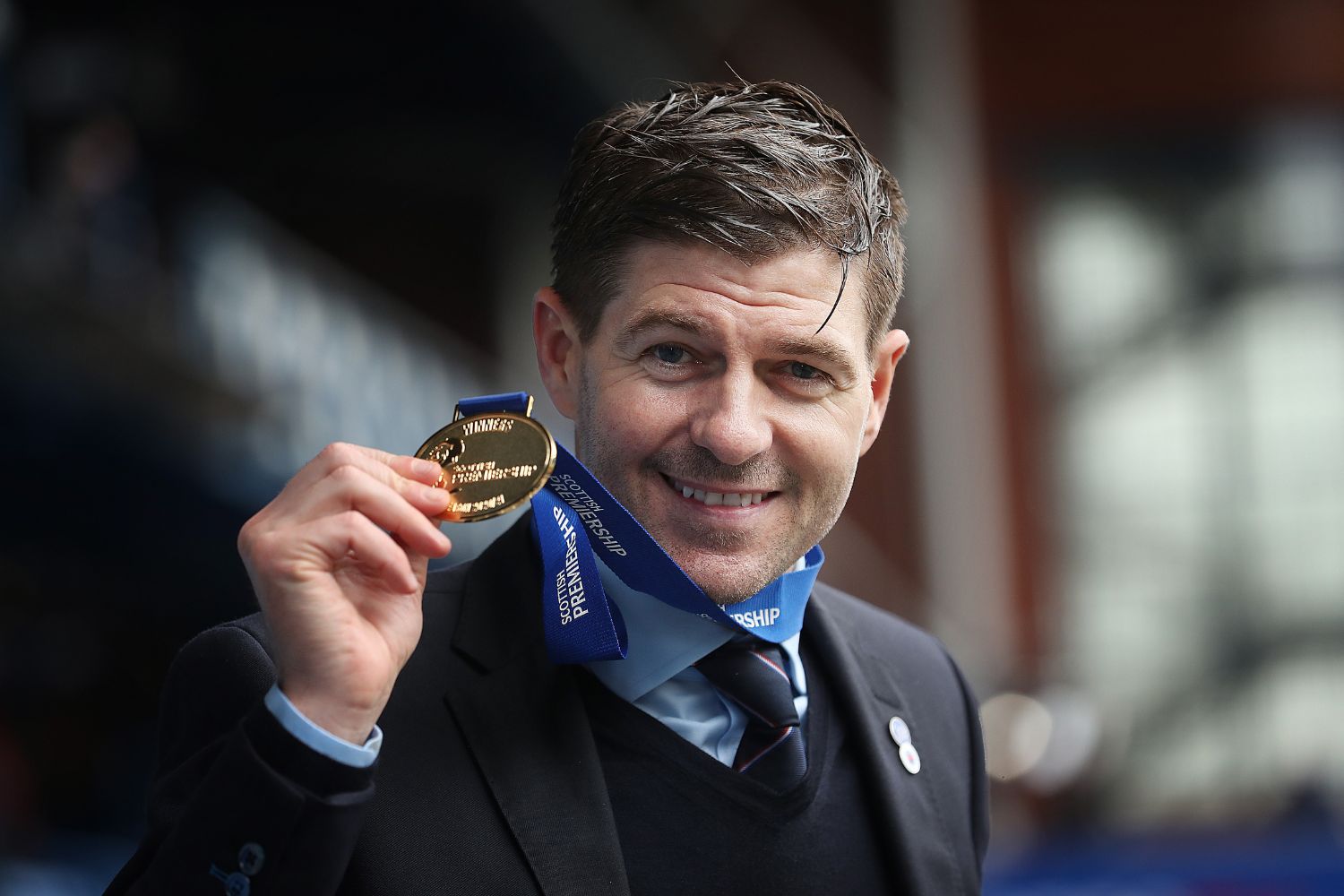 Steven Gerrard celebrates winning the league with Rangers