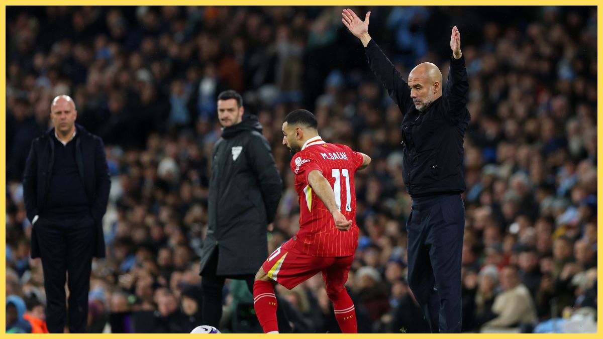 Mo Salah controls the ball, as Pep Guardiola, of Manchester City, reacts
