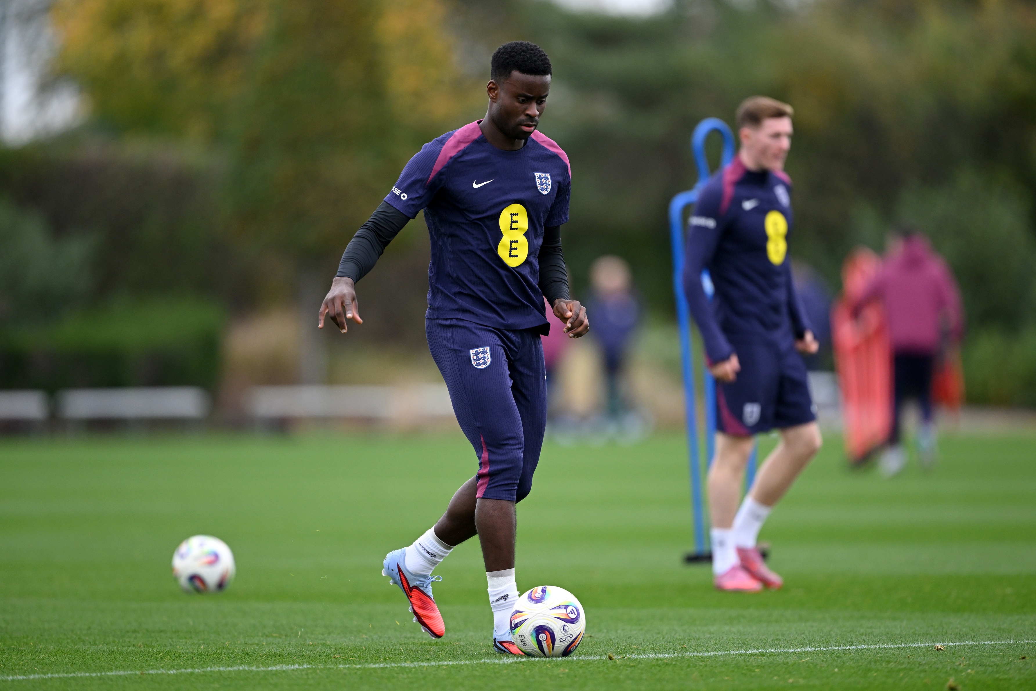 Marc Guehi runs with the ball during England training.