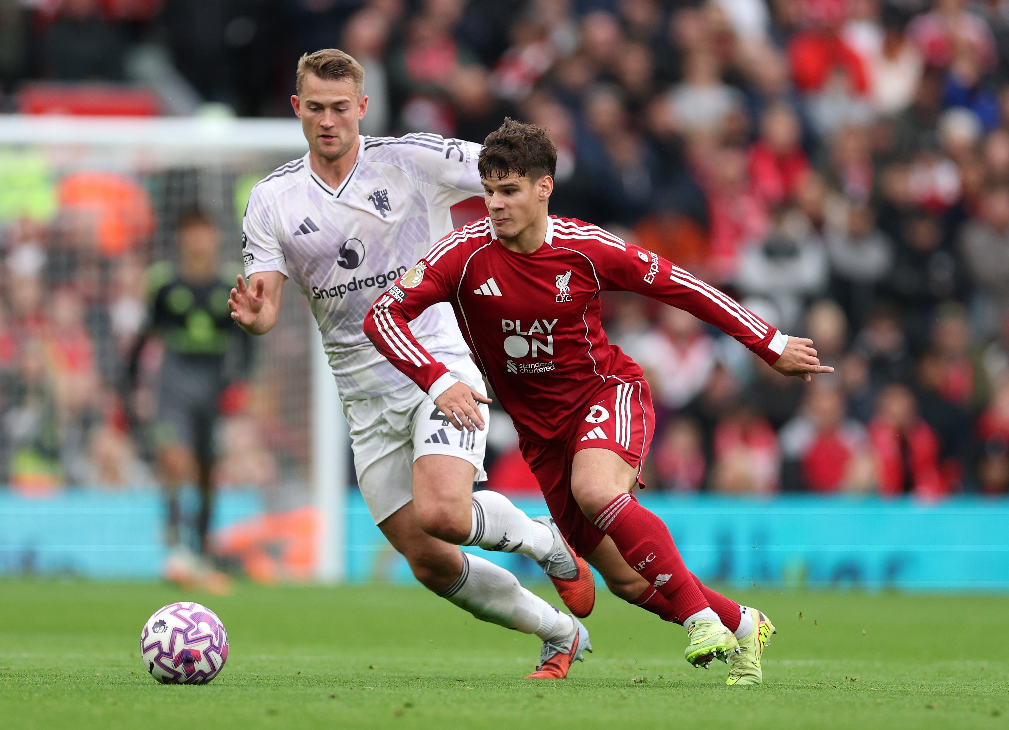 Milos Kerkez dribbles past Manchester United defender Matthijs de Ligt.