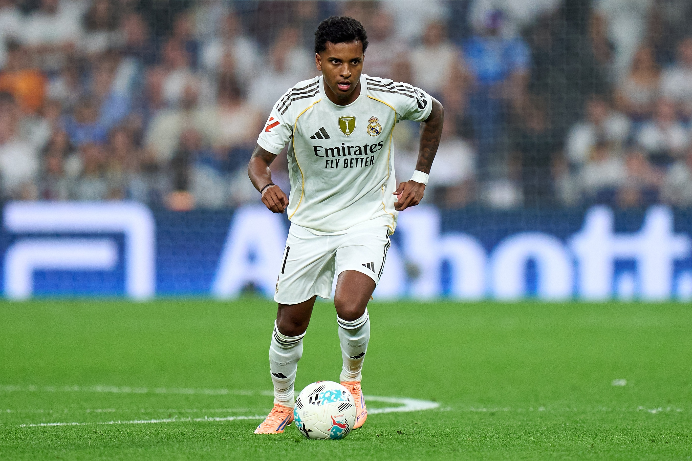 Rodrygo runs with the ball at his feet.