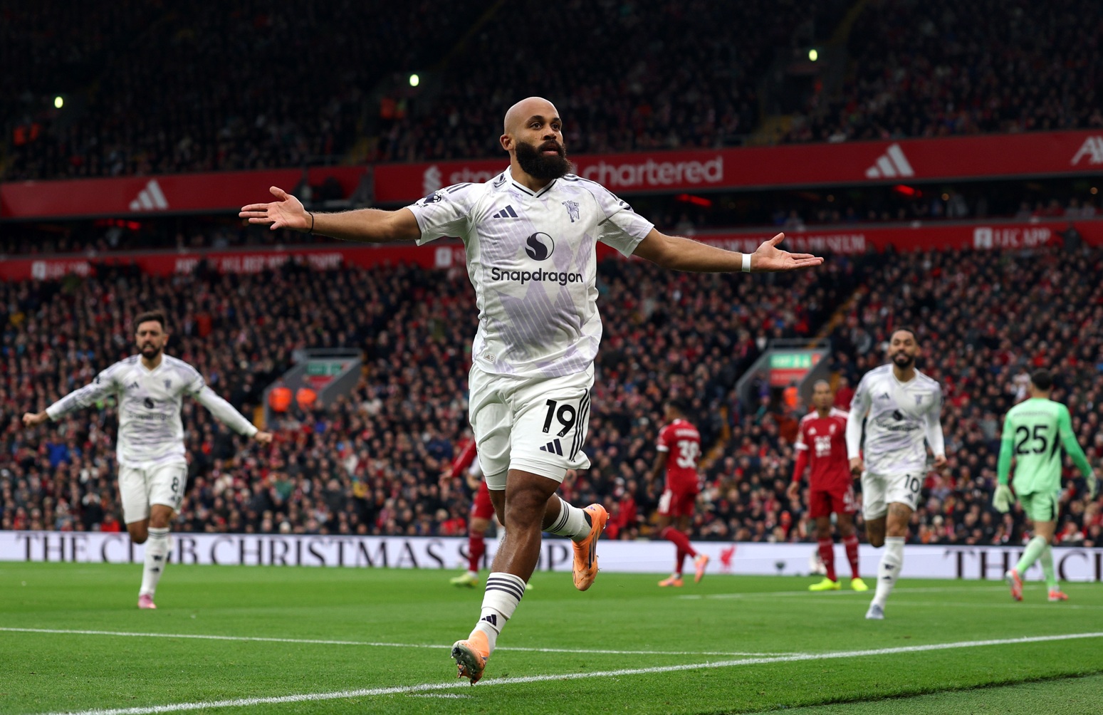 Bryan Mbeumo celebrates scoring against Liverpool at Anfield