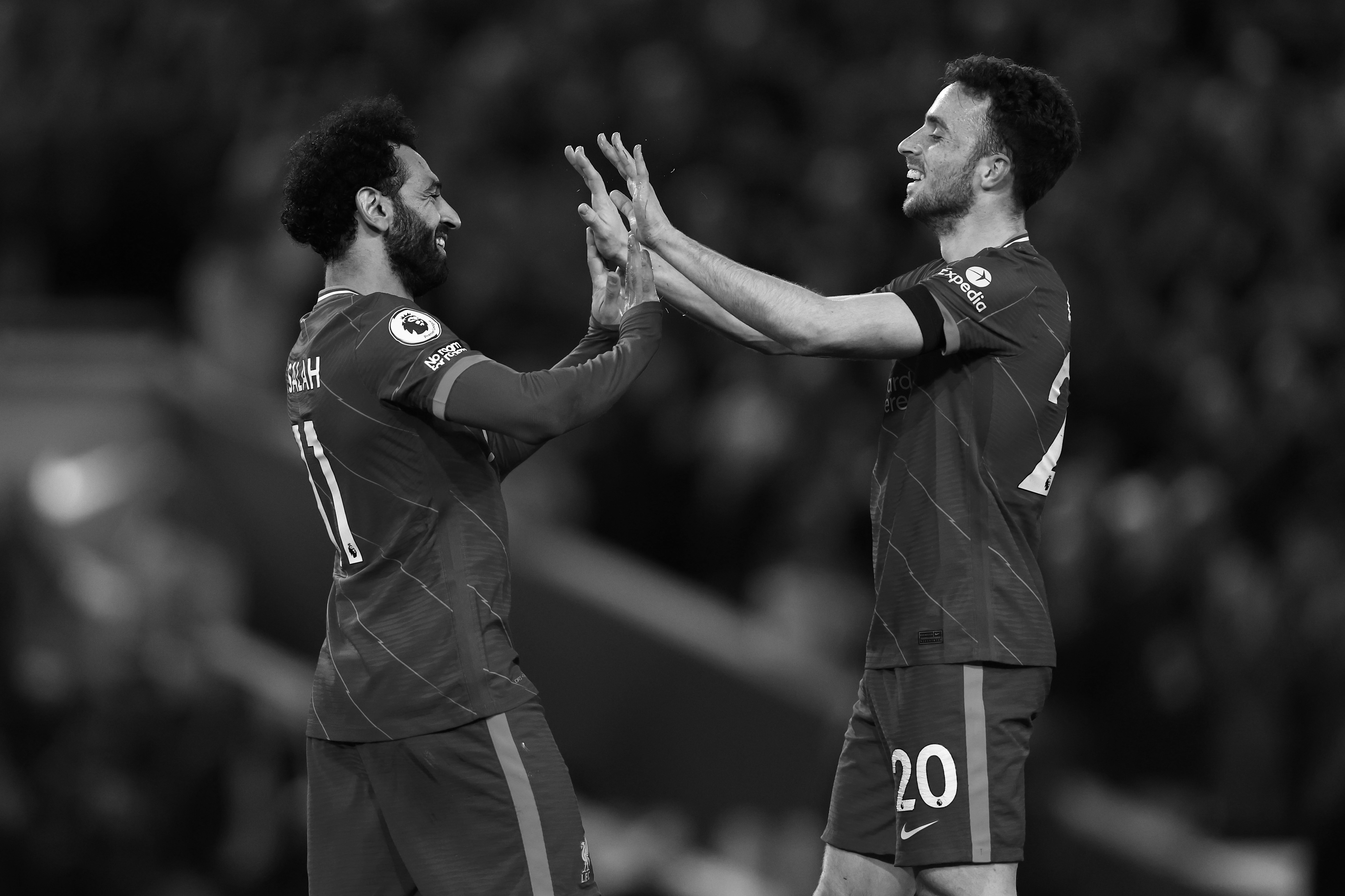 Mo Salah and the late Diogo Jota celebrate a goal against Manchester United in 2022