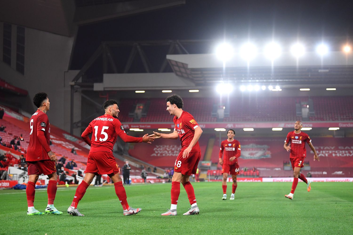 Curtis Jones and Alex Oxlade-Chamberlain celebrate together