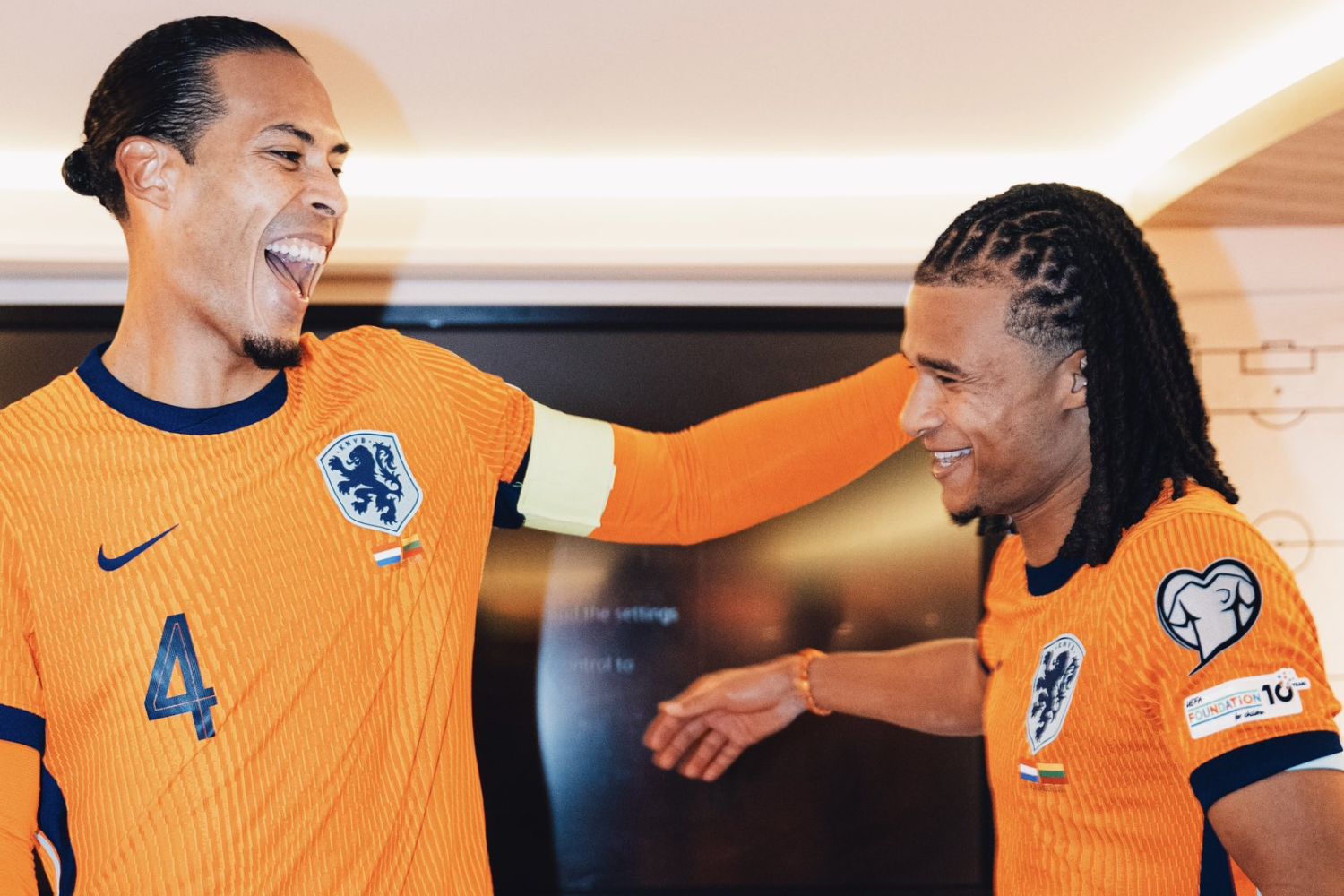 Virgil van Dijk congratulated by Nathan Ake after breaking Dutch captain appearance record